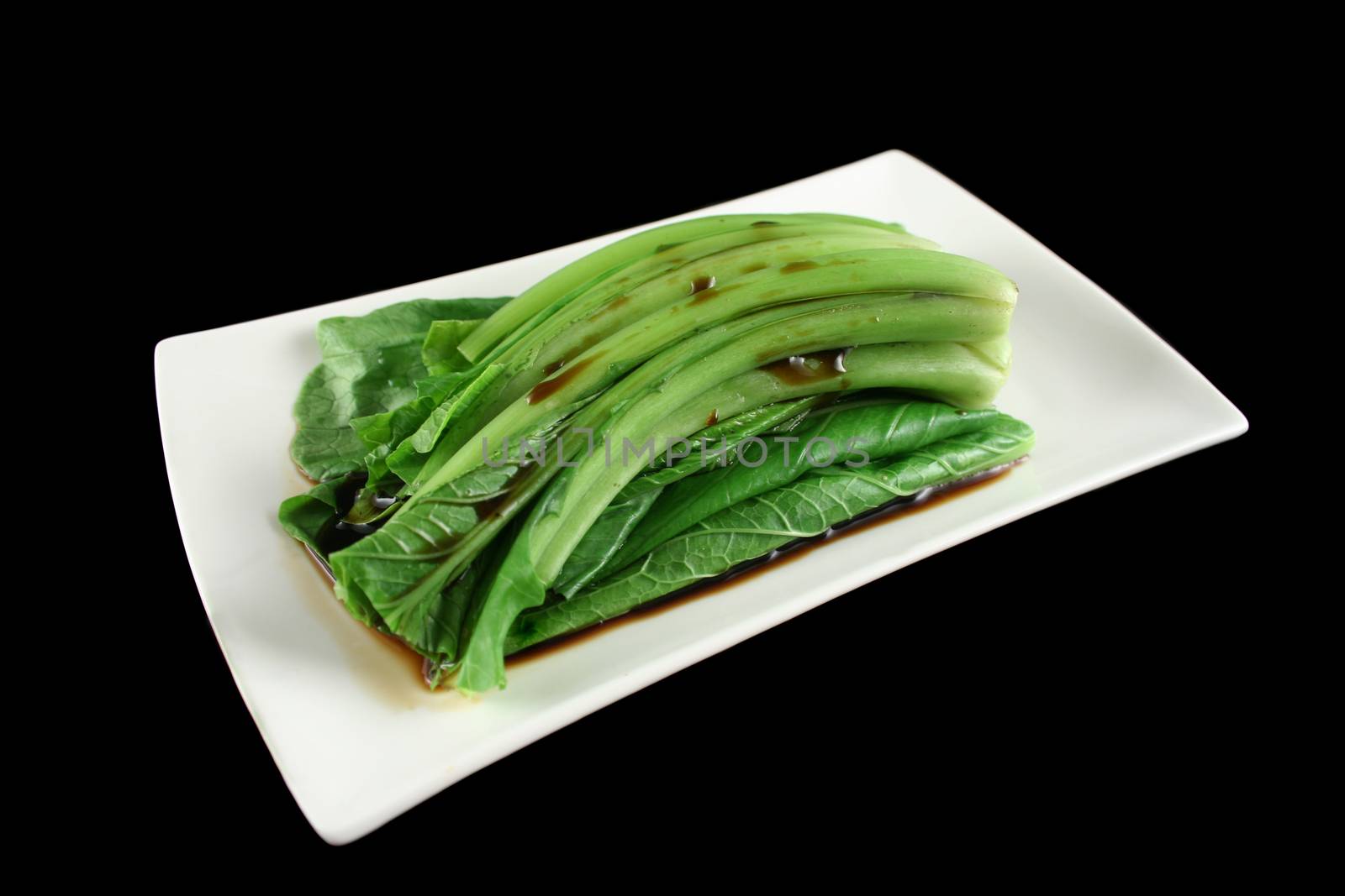 Soy sauce poured over the Asian vegetable Choy Sum.