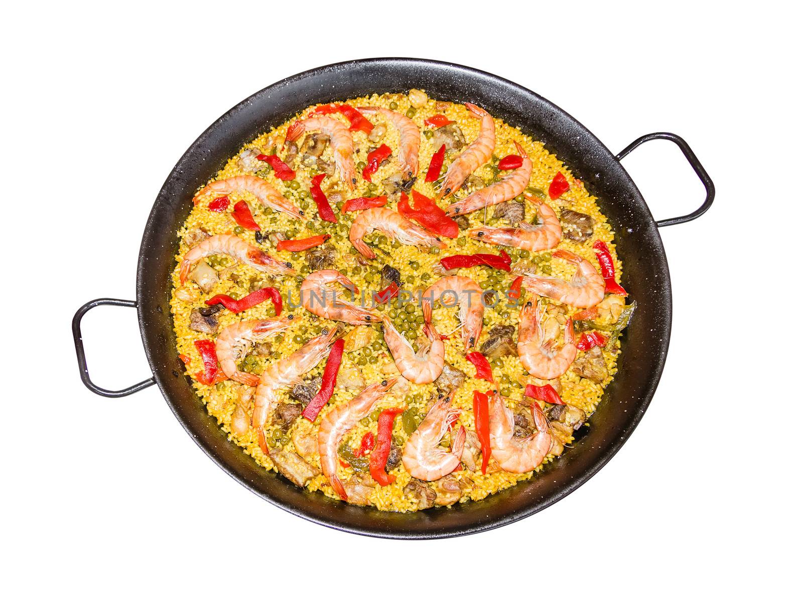 Traditional spanish paella cooked in a pan, with yellow rice and seafood, isolated on white background