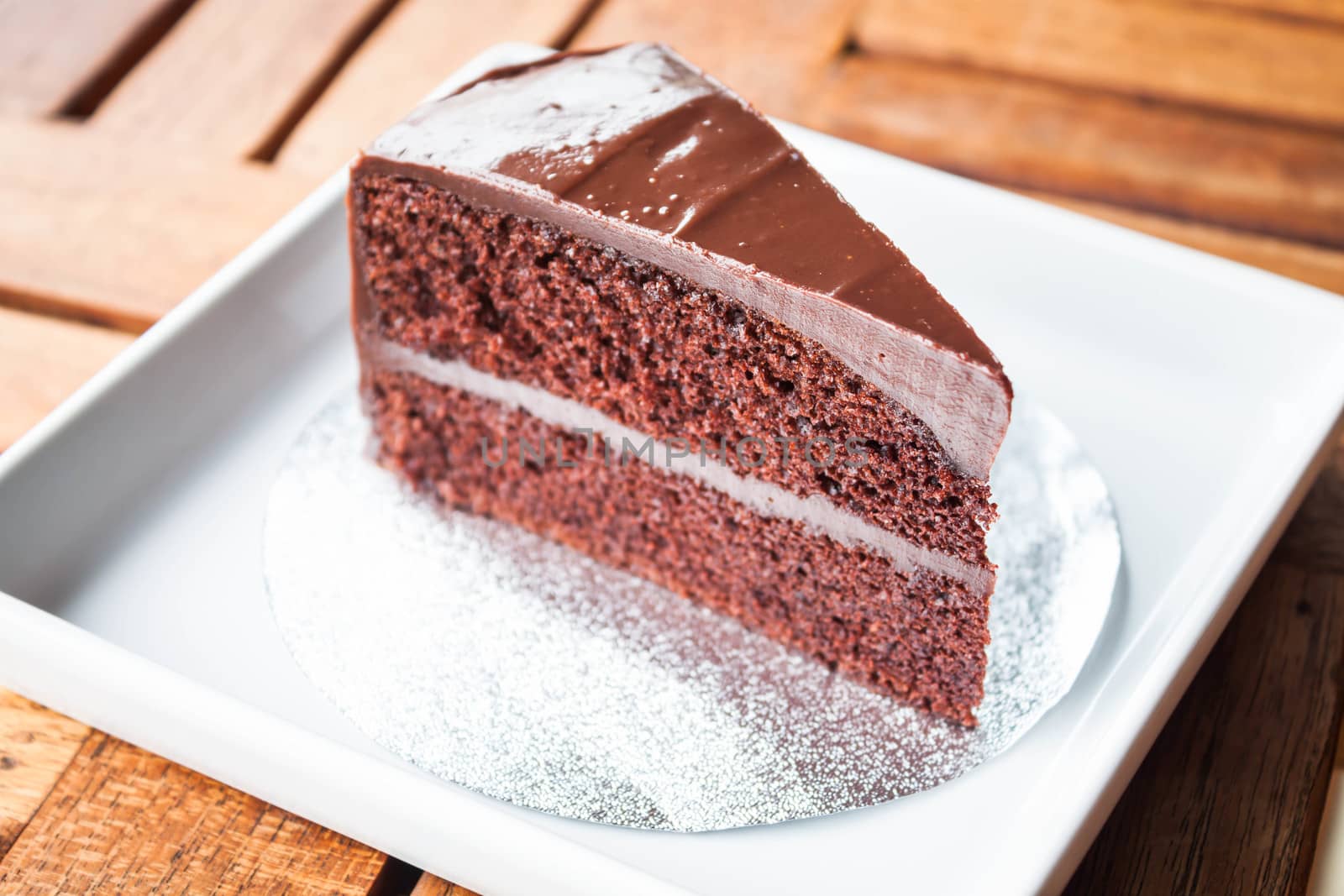 Chocolate chiffon cake serving on white plate