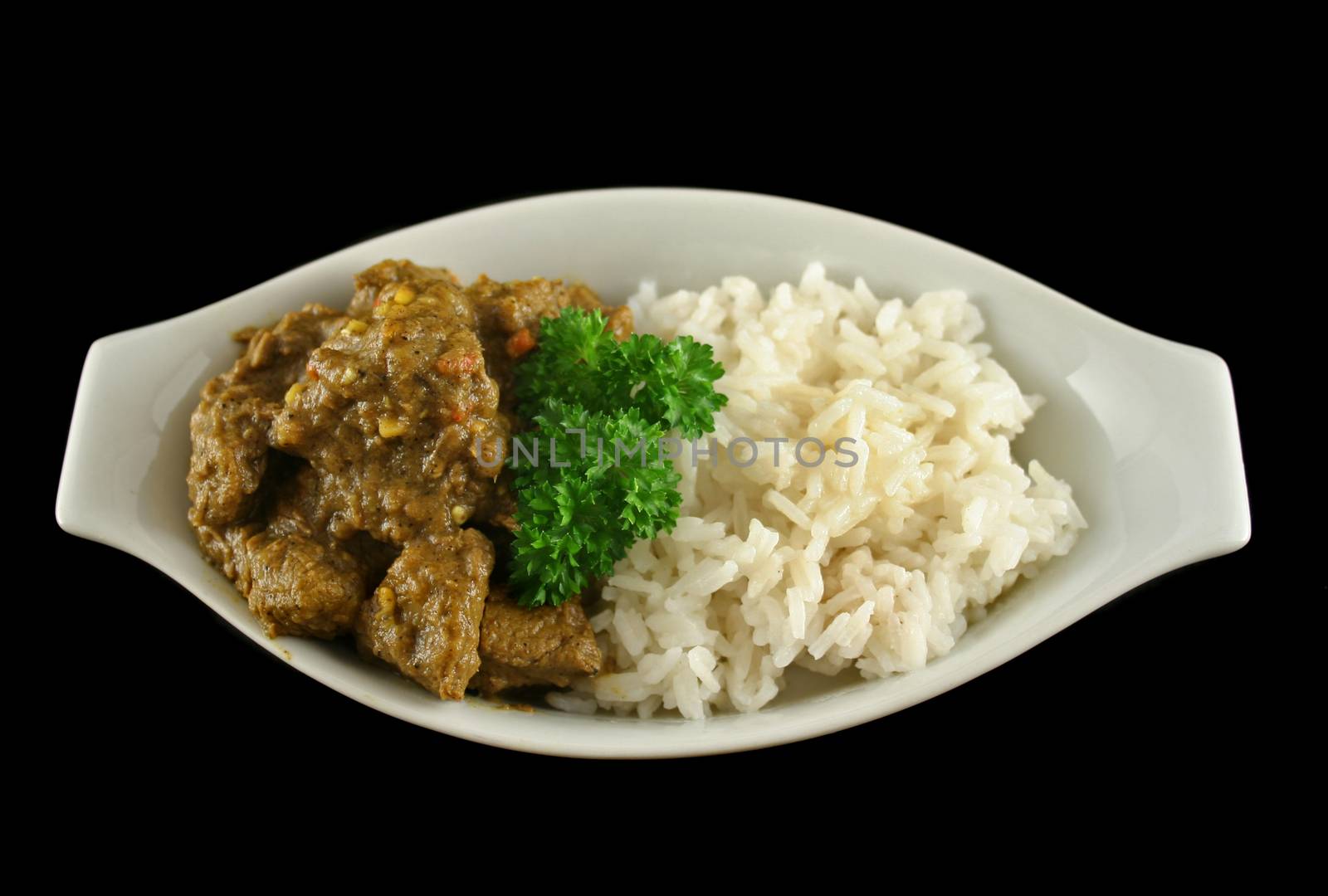 Beef vindaloo and rice ready to serve.