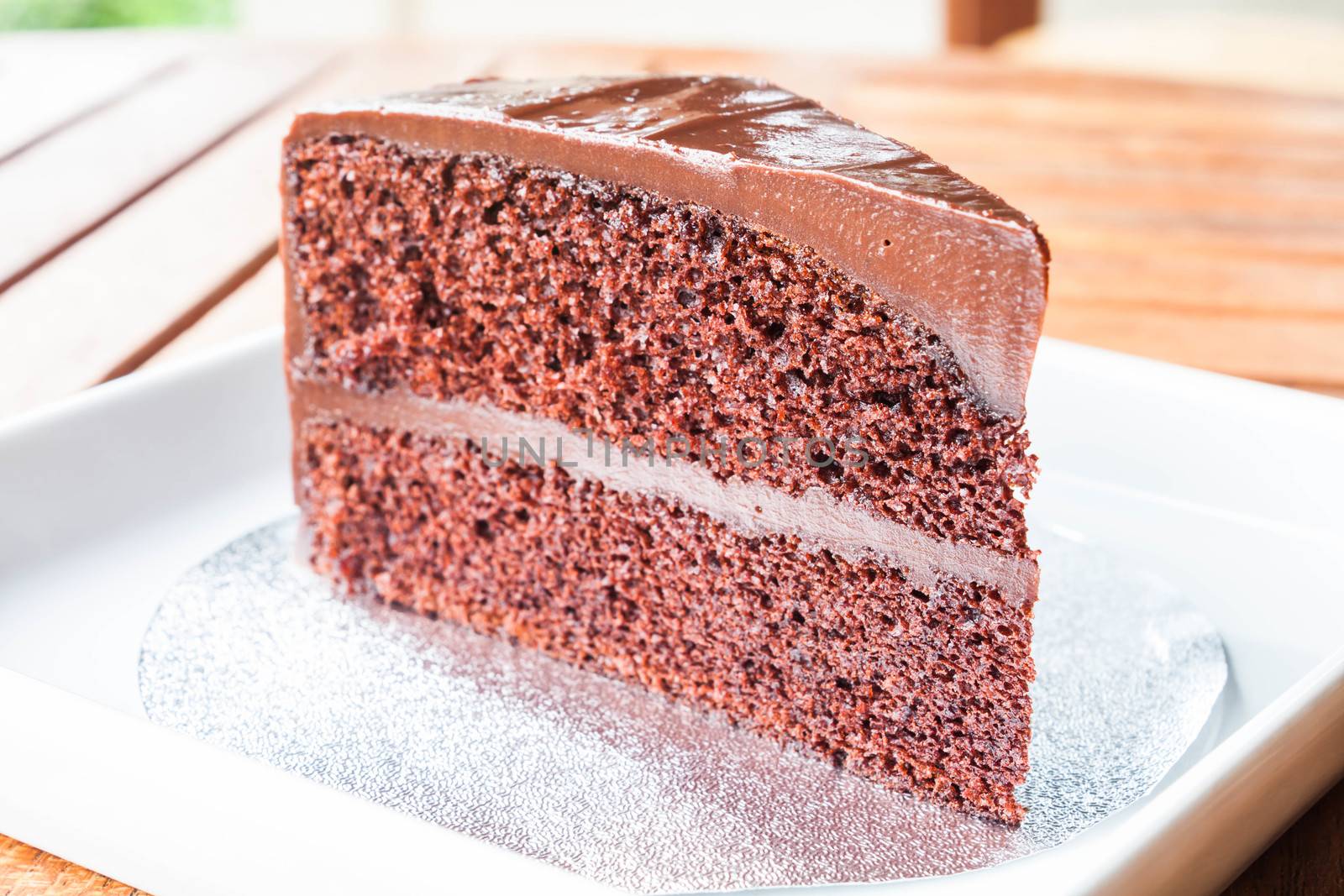 Close up piece of chocolate sponge cake by punsayaporn