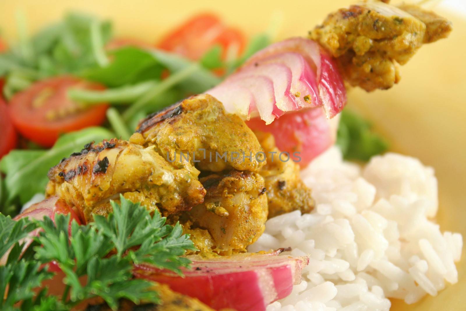 Chicken tandoori skewers with minted yogurt and a rocket salad.