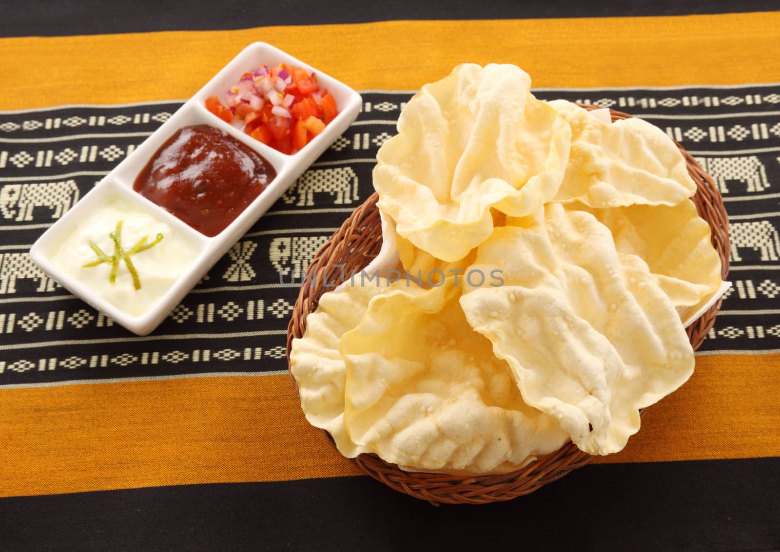 Crispy pappadums with with three delicious sambal condiments.