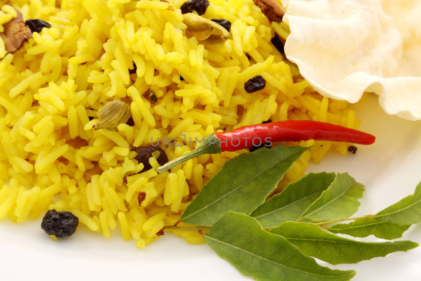 Delicious spicy rice with tumeric, chilli, cardamon and curry leaf.
