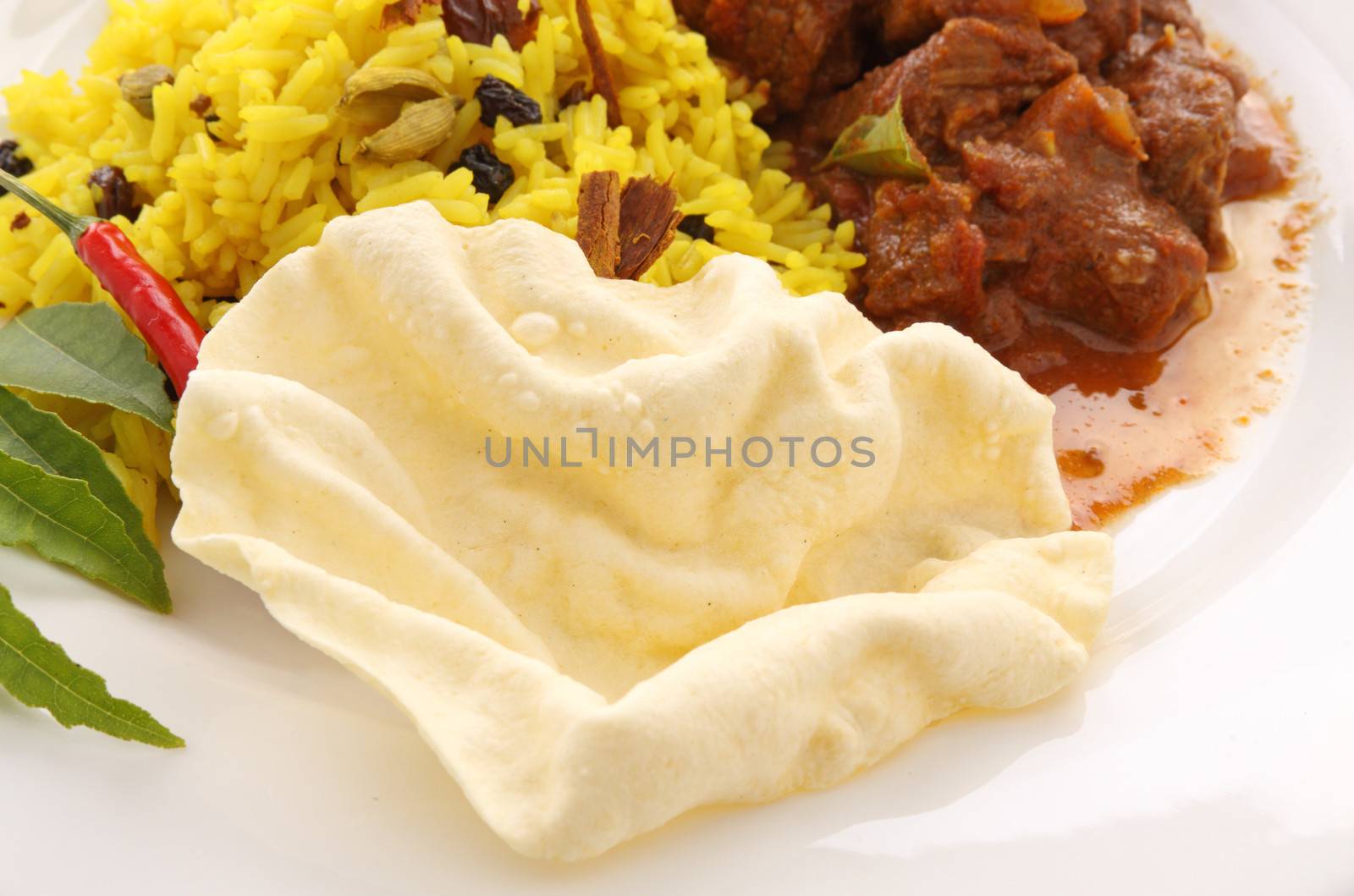 Crispy fried pappadum with Indian beef curry.
