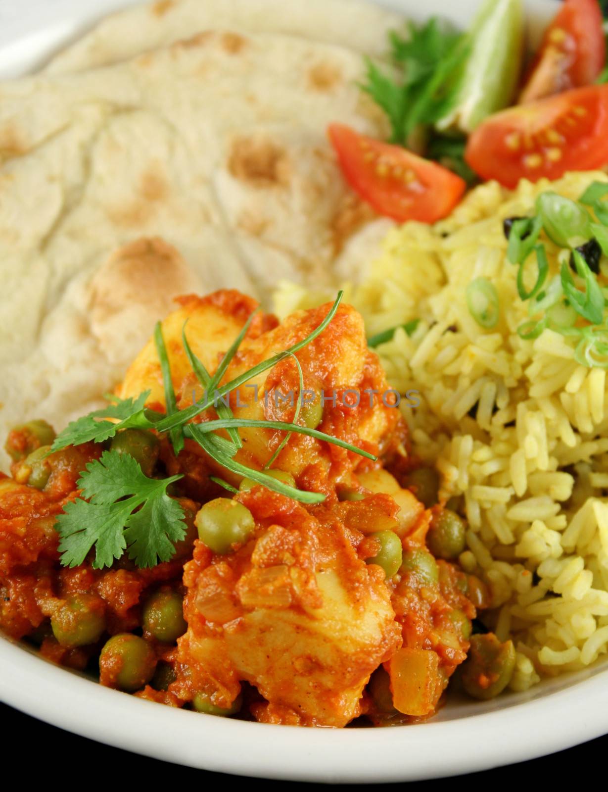 Indian pea and potato curry with tumeric rice and a side salad.