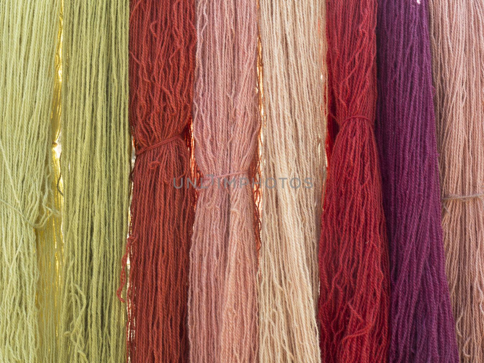 Vegetable dyed knitting wool seen on a medieval market.