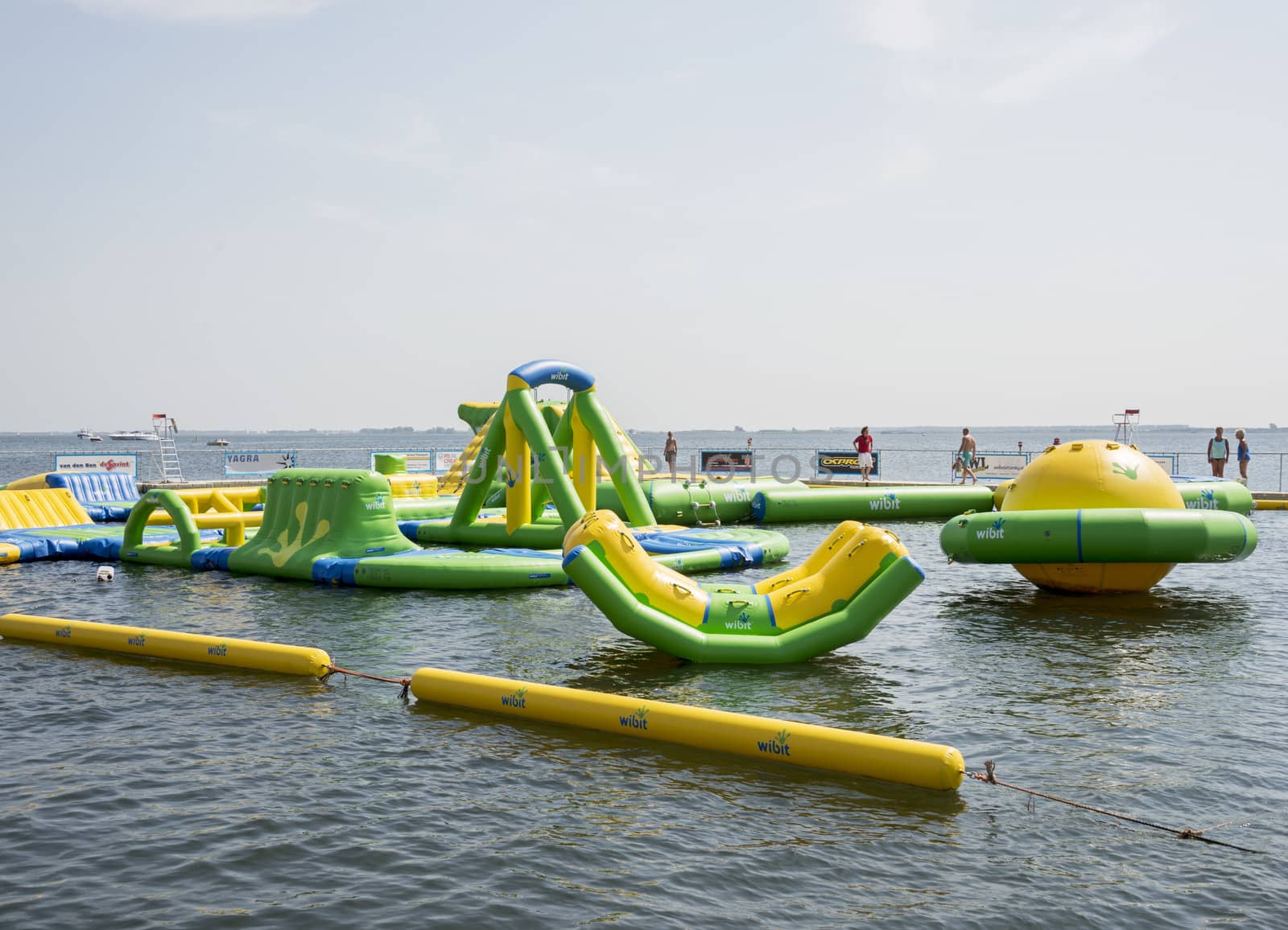 HELLEVOETSLUIS,HOLLAND - JULY 08:Unidentified children having pun in the aqua splash park ,on July 08,2013 in Hellevoetsluisk, Holland.This water park is the only open water park in Holland