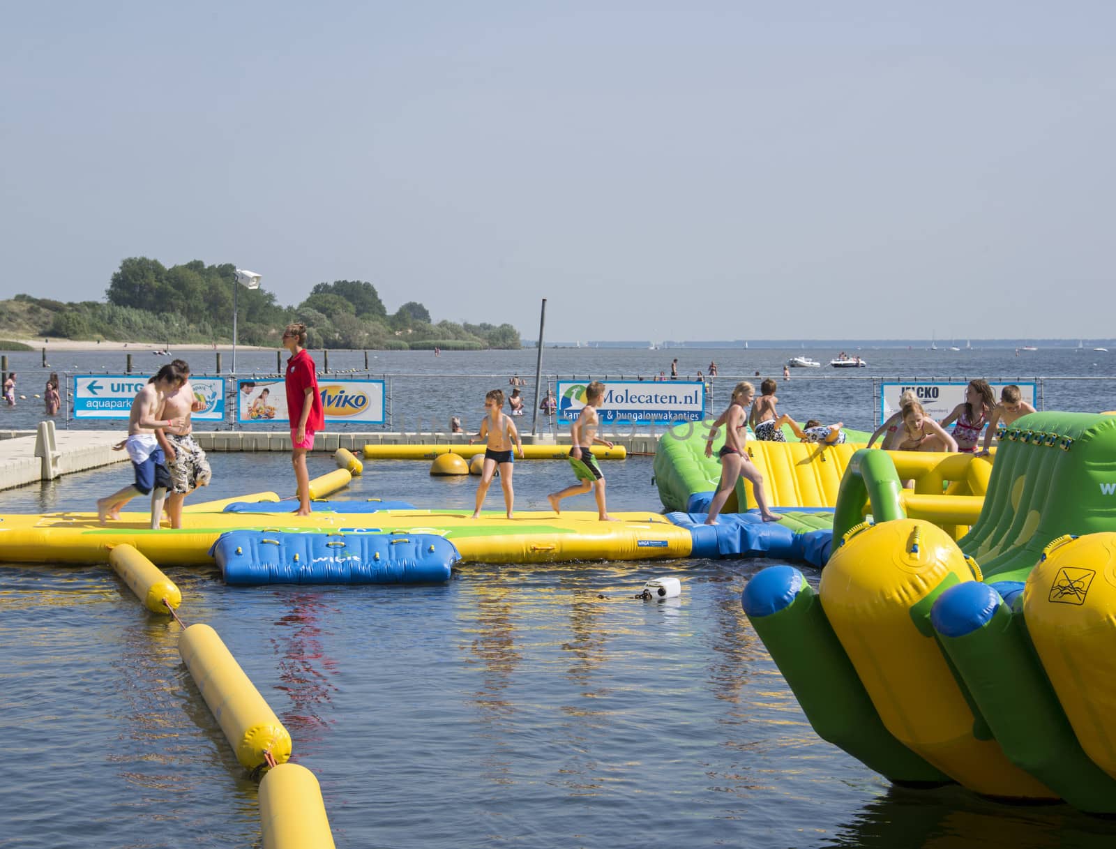 HELLEVOETSLUIS,HOLLAND - JULY 08:Unidentified children having pun in the aqua splash park ,on July 08,2013 in Hellevoetsluisk, Holland.This water park is the only open water park in Holland
