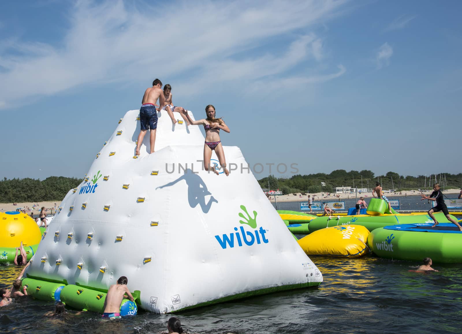 HELLEVOETSLUIS,HOLLAND - JULY 08:Unidentified children having pun in the aqua splash park ,on July 08,2013 in Hellevoetsluisk, Holland.This water park is the only open water park in Holland