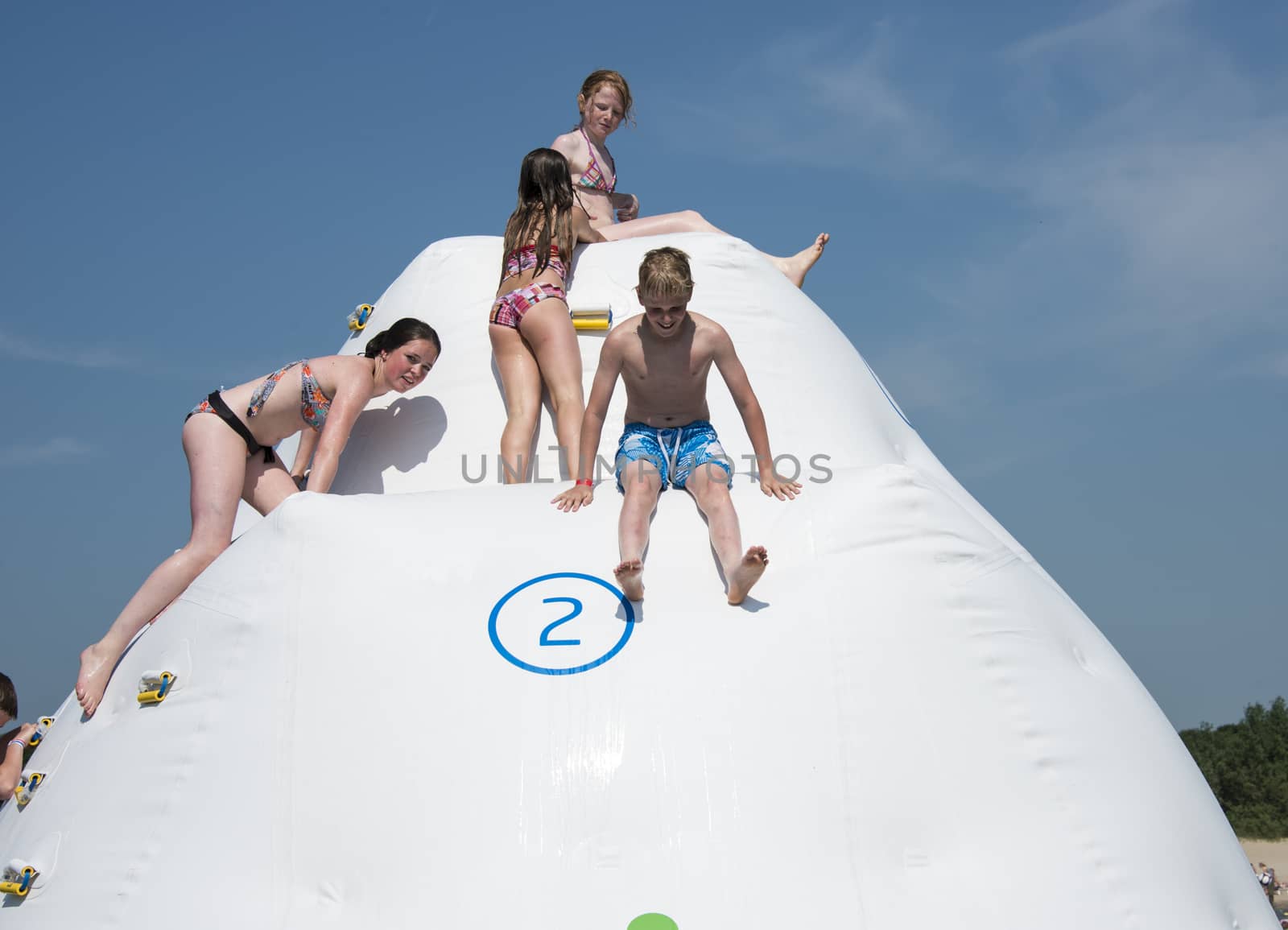 HELLEVOETSLUIS,HOLLAND - JULY 08:Unidentified children having pun in the aqua splash park ,on July 08,2013 in Hellevoetsluisk, Holland.This water park is the only open water park in Holland