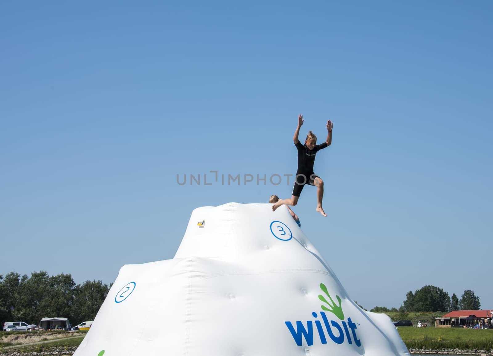 HELLEVOETSLUIS,HOLLAND - JULY 08:Unidentified children having pun in the aqua splash park ,on July 08,2013 in Hellevoetsluisk, Holland.This water park is the only open water park in Holland