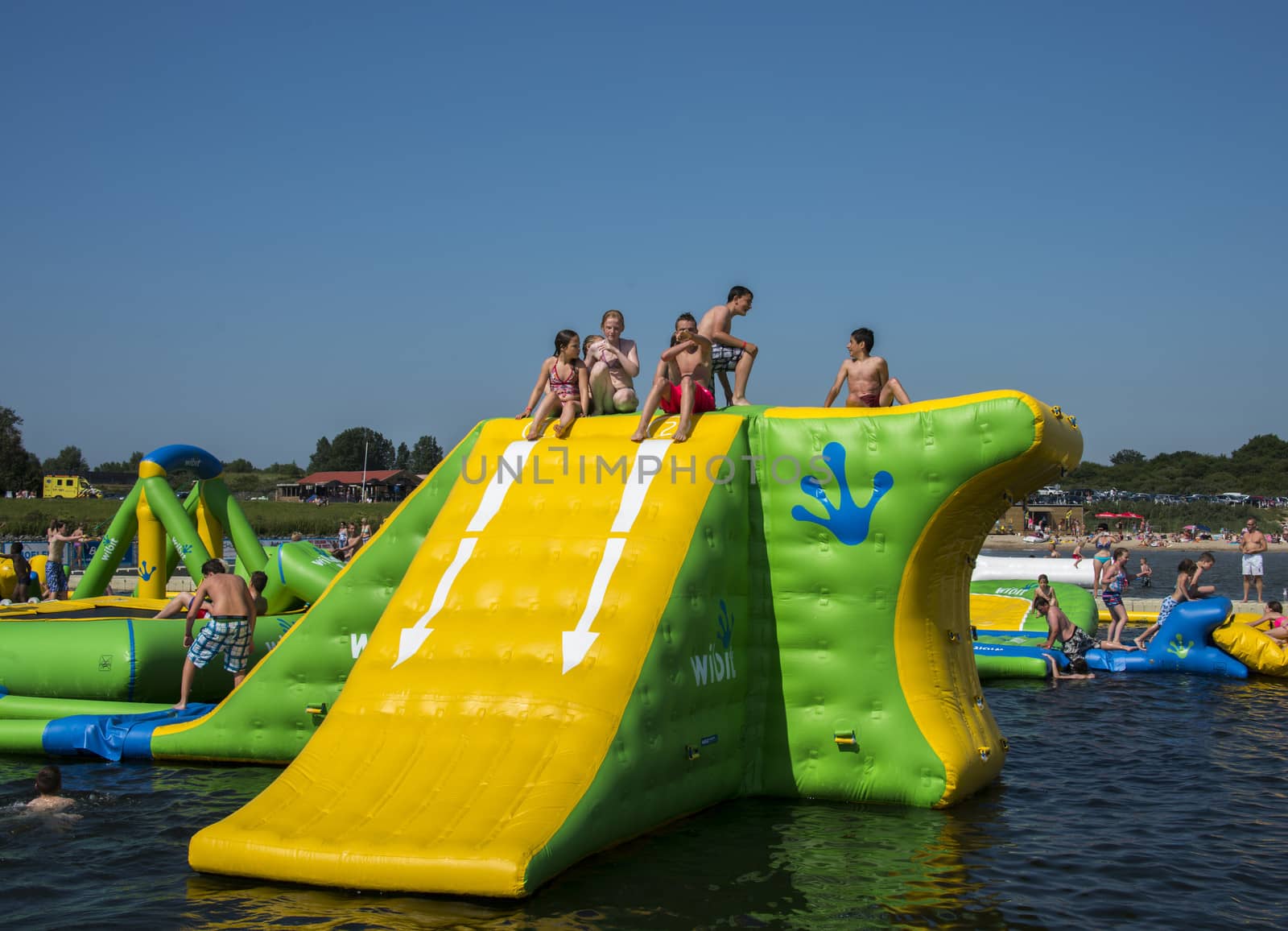 HELLEVOETSLUIS,HOLLAND - JULY 08:Unidentified children having pun in the aqua splash park ,on July 08,2013 in Hellevoetsluisk, Holland.This water park is the only open water park in Holland