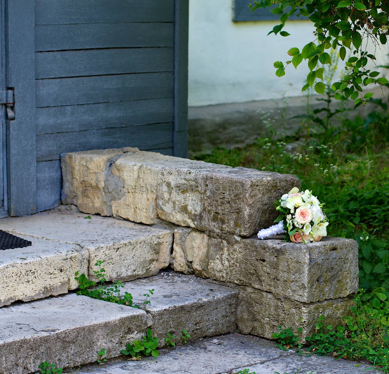 Beautiful Bride Bouquet Forgotten on Stone Steps outdoors