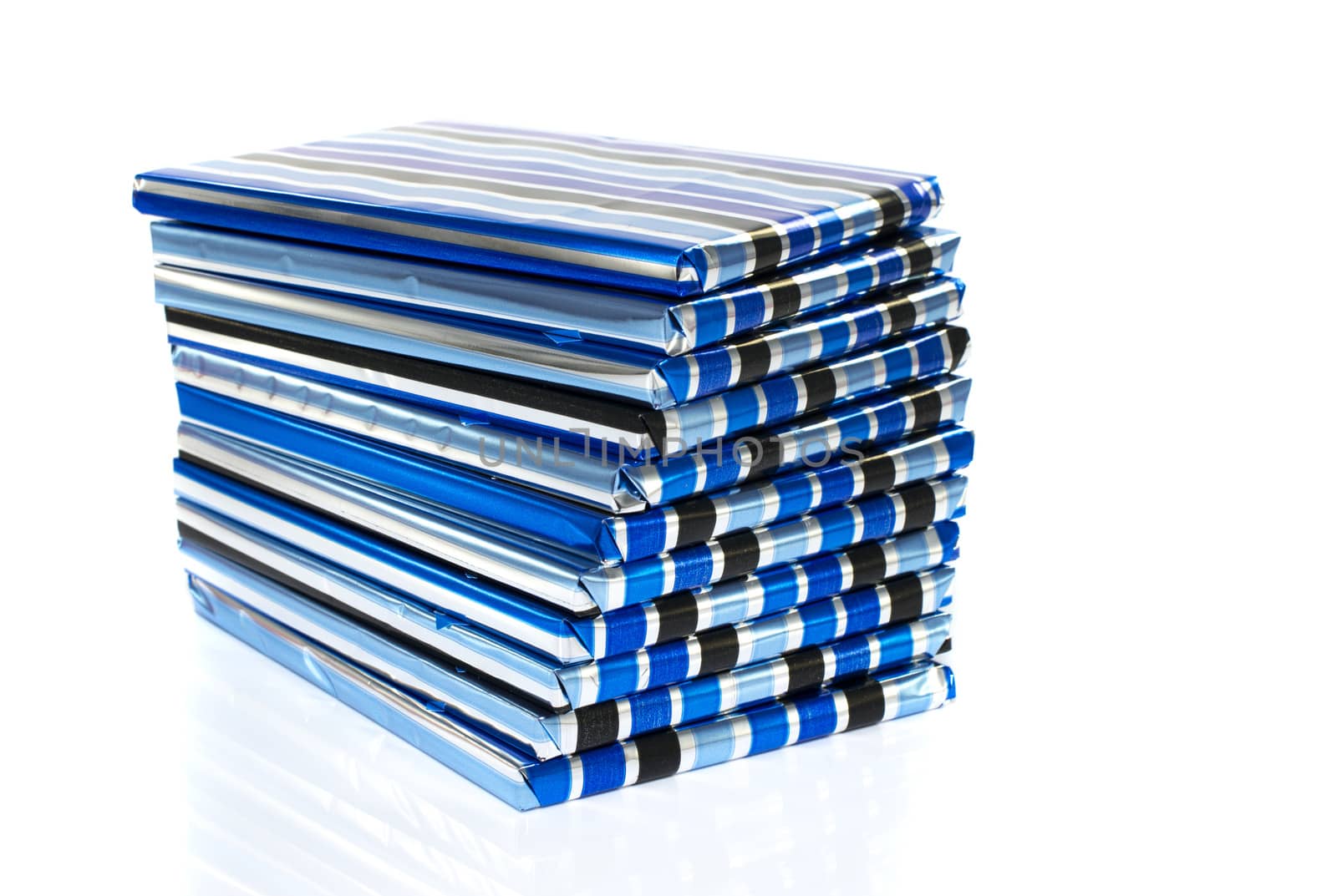 stack of presents in blue silver and black isolated on white background