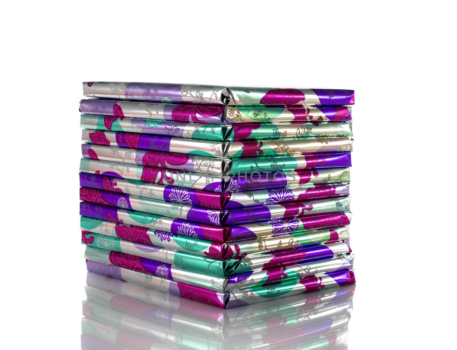 stack of presents in pink silver and green isolated on white background
