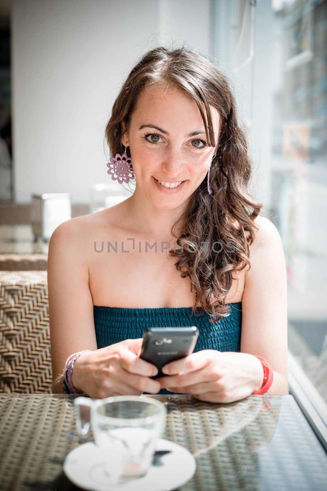 young beautiful woman on the phone by peus