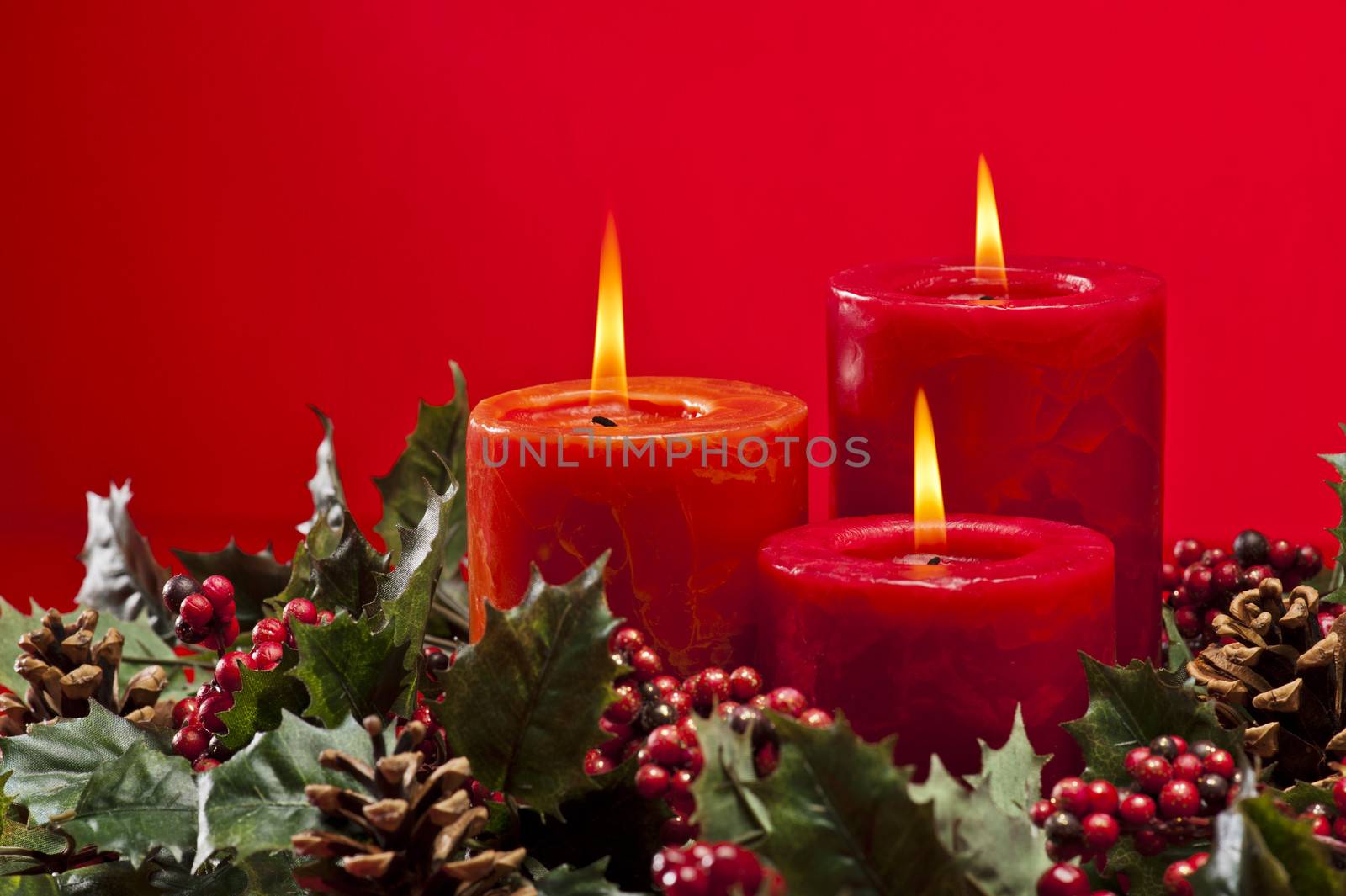 Red advent wreath with candles by 3523Studio