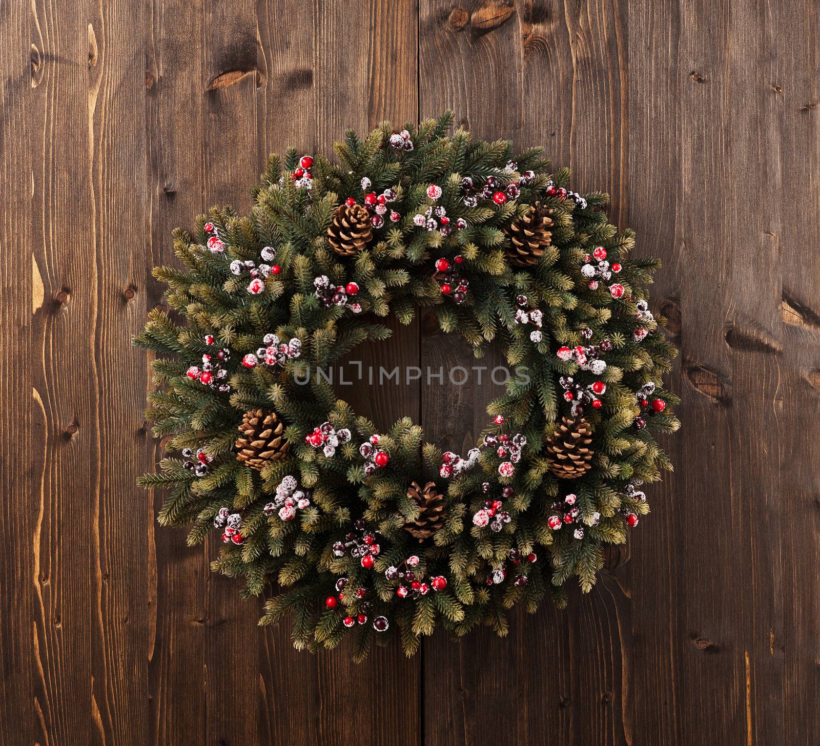 Advent Christmas wreath on wooden door decoration