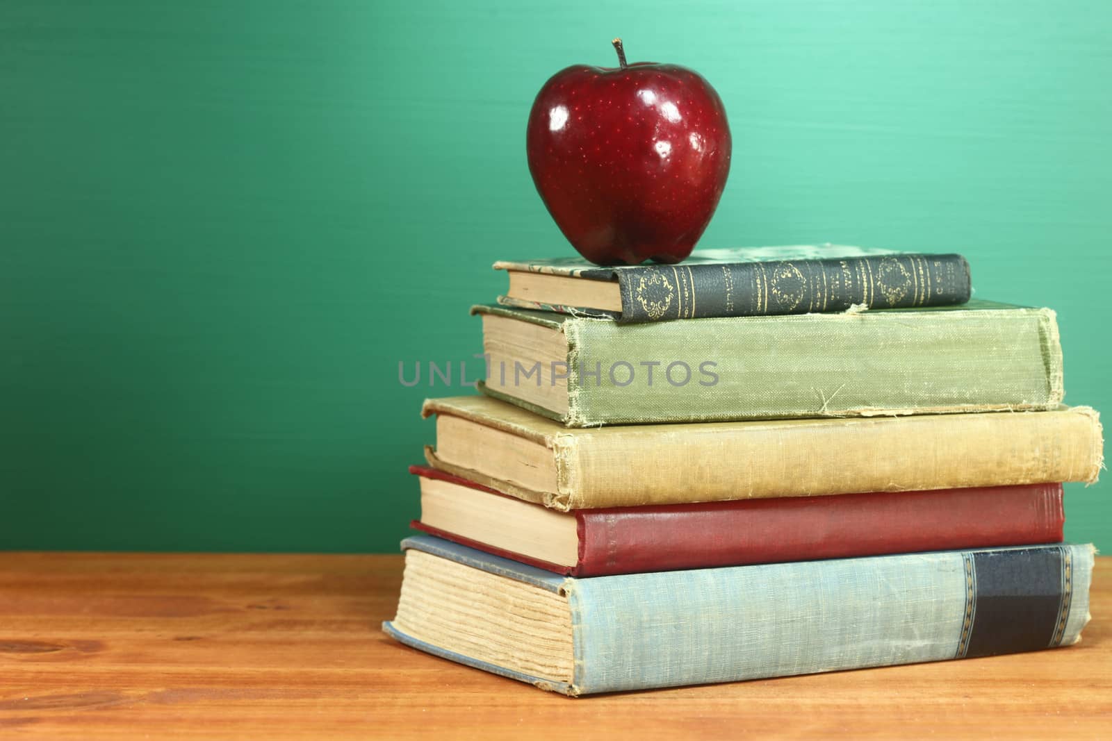 Copy Space Back to School Books and Apple With Chalkboard