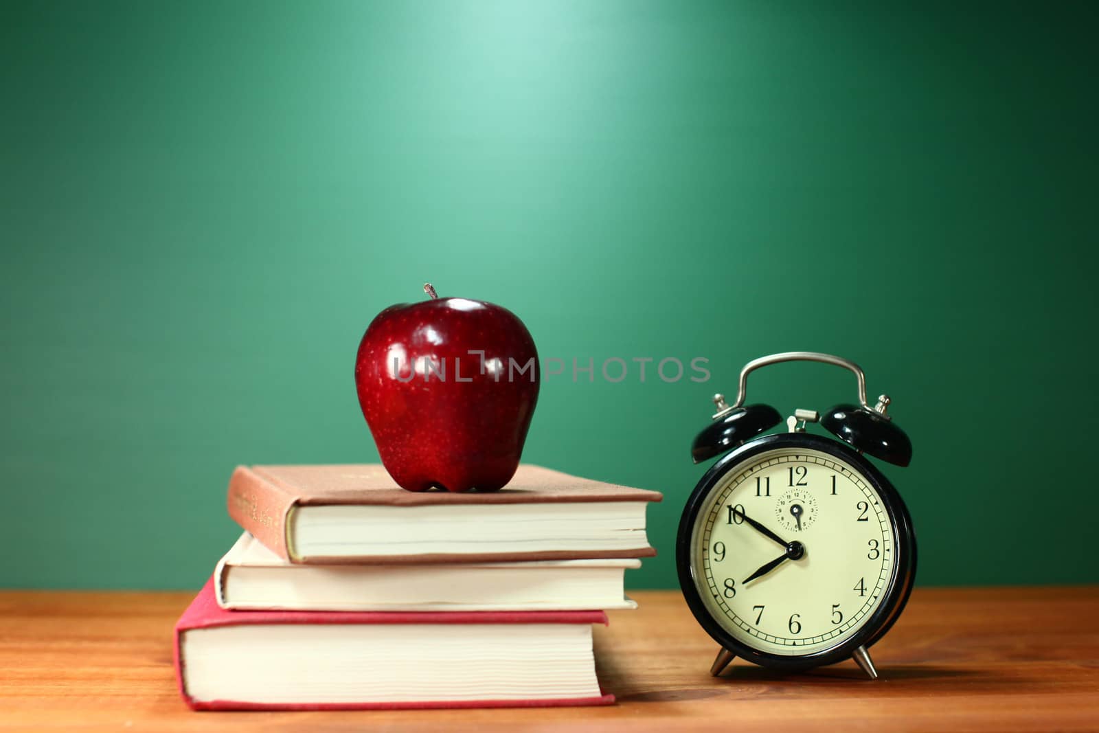 Back to School Books, Apple and Clock on Desk