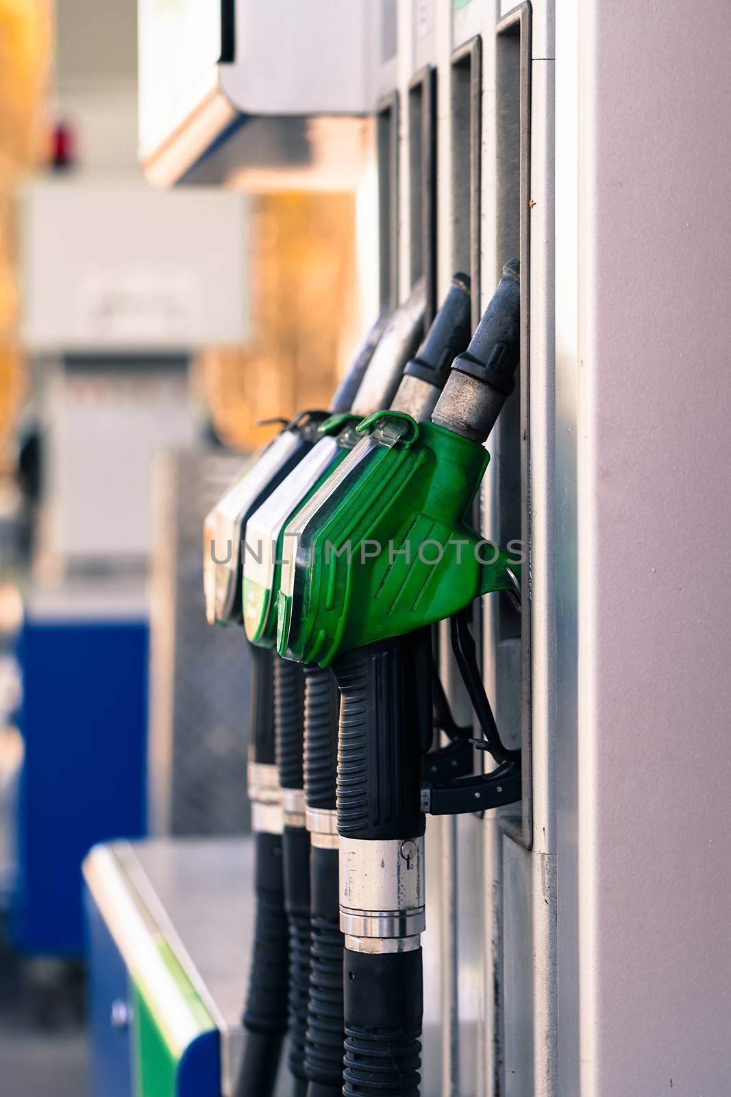 Pump nozzles at the gas station.  by motorolka