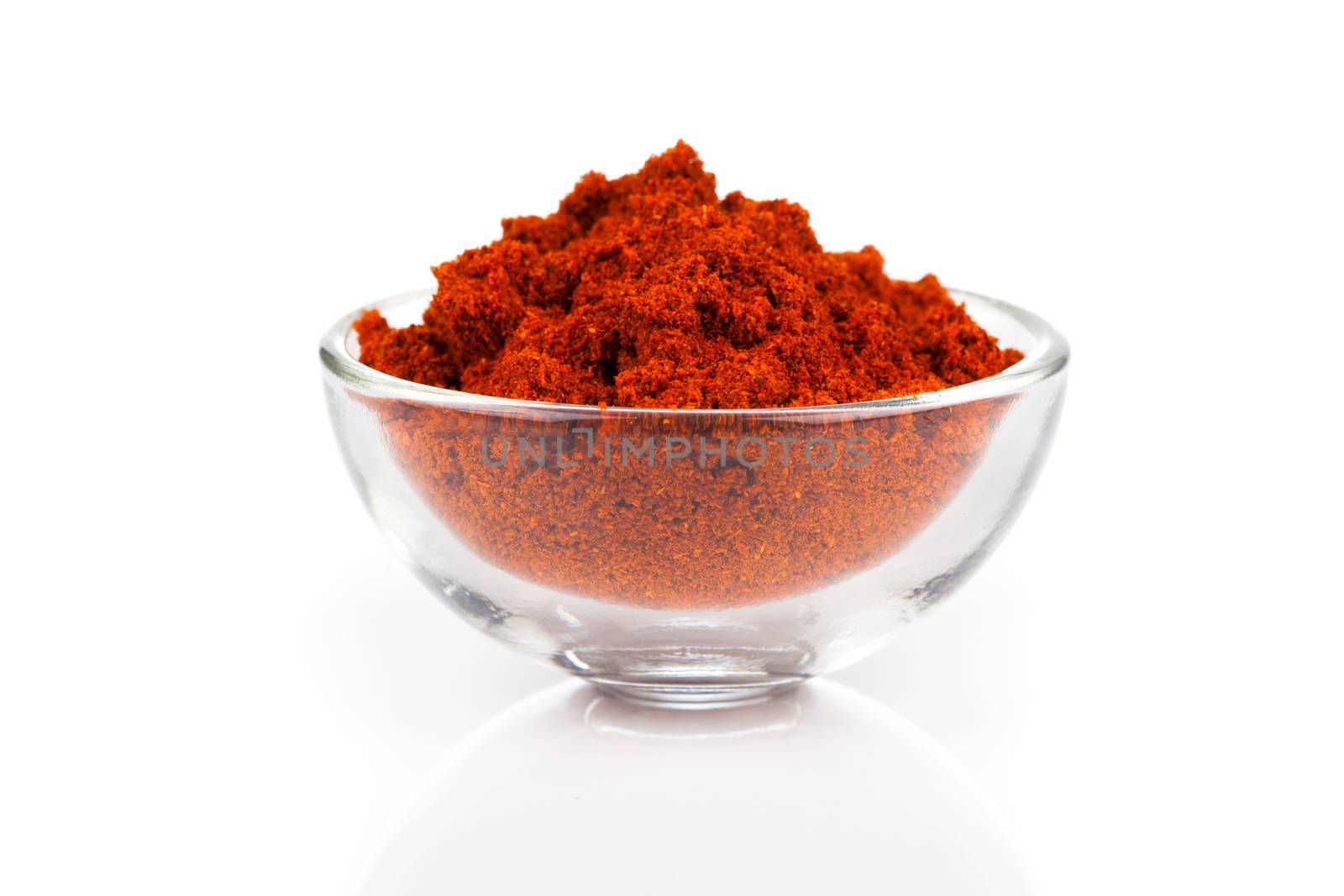 paprika spice in glass bowls, isolated on white background