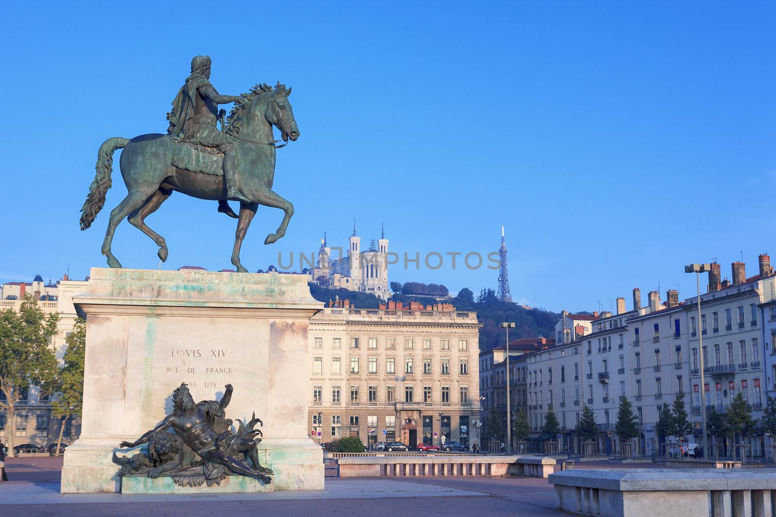 Statue and Notre Dame de Fourviere on a background