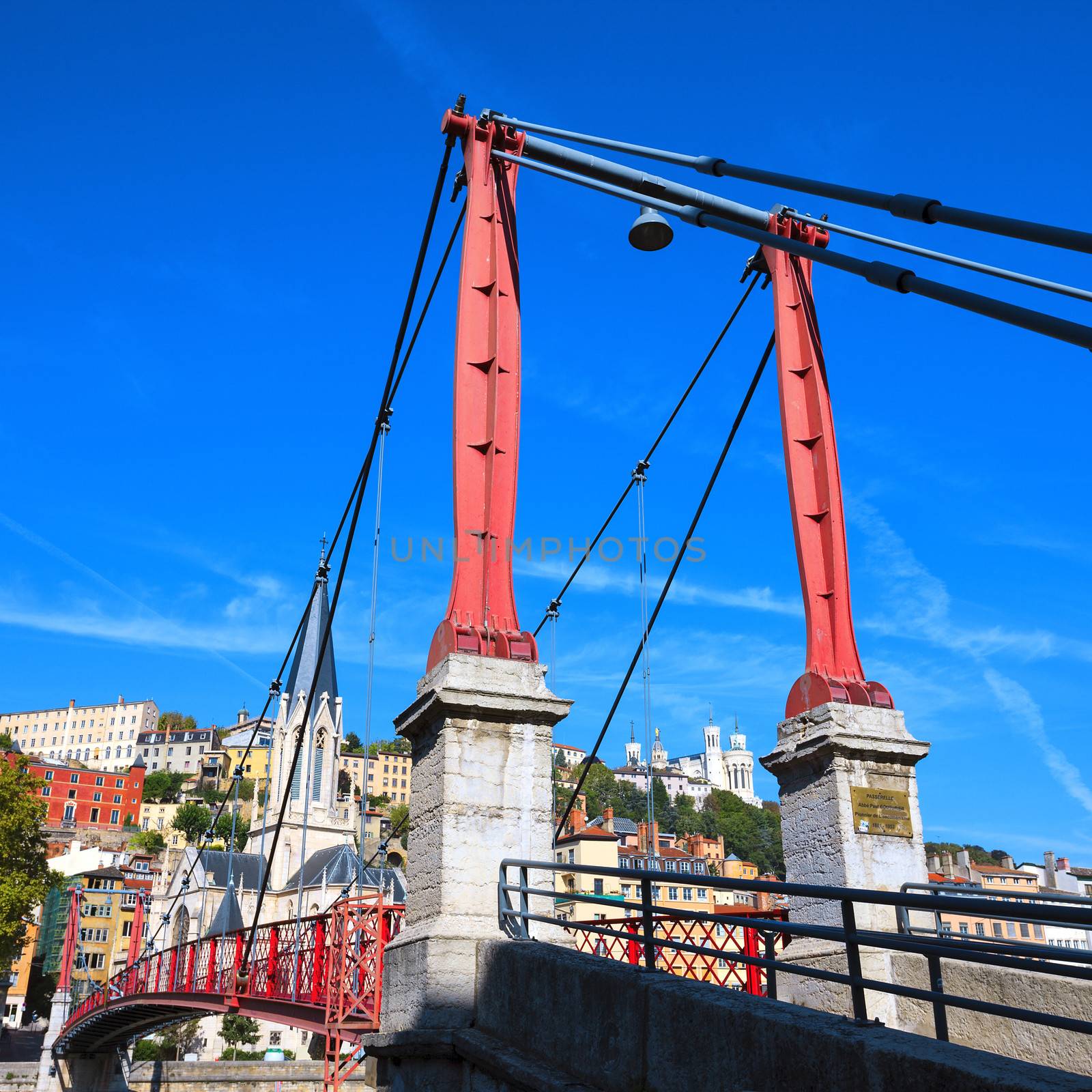 Part of Lyon city with red footbridge on Saone river