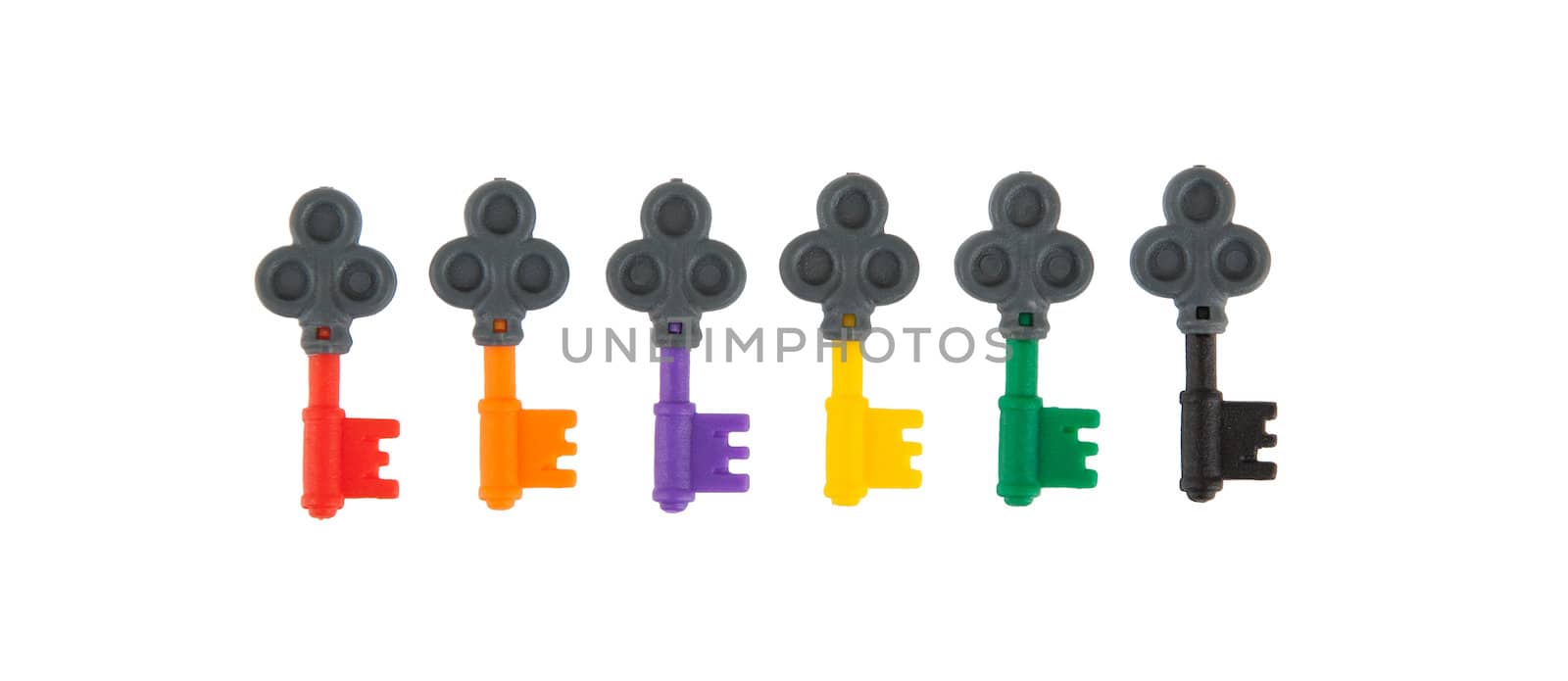 Six small keys, each with a different color, isolated on white