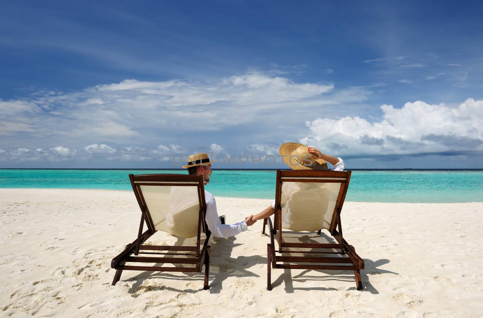 Couple on a tropical beach at Maldives