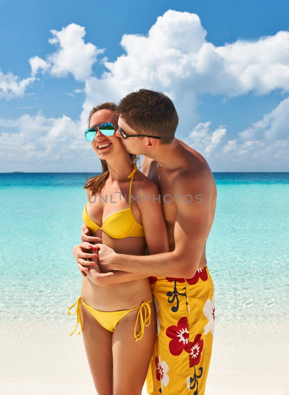 Couple on a beach at Maldives by haveseen