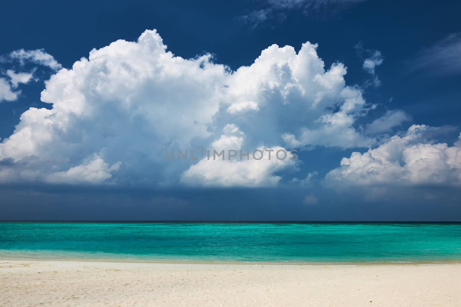 Crystal clear turquoise water at tropical maldivian beach
