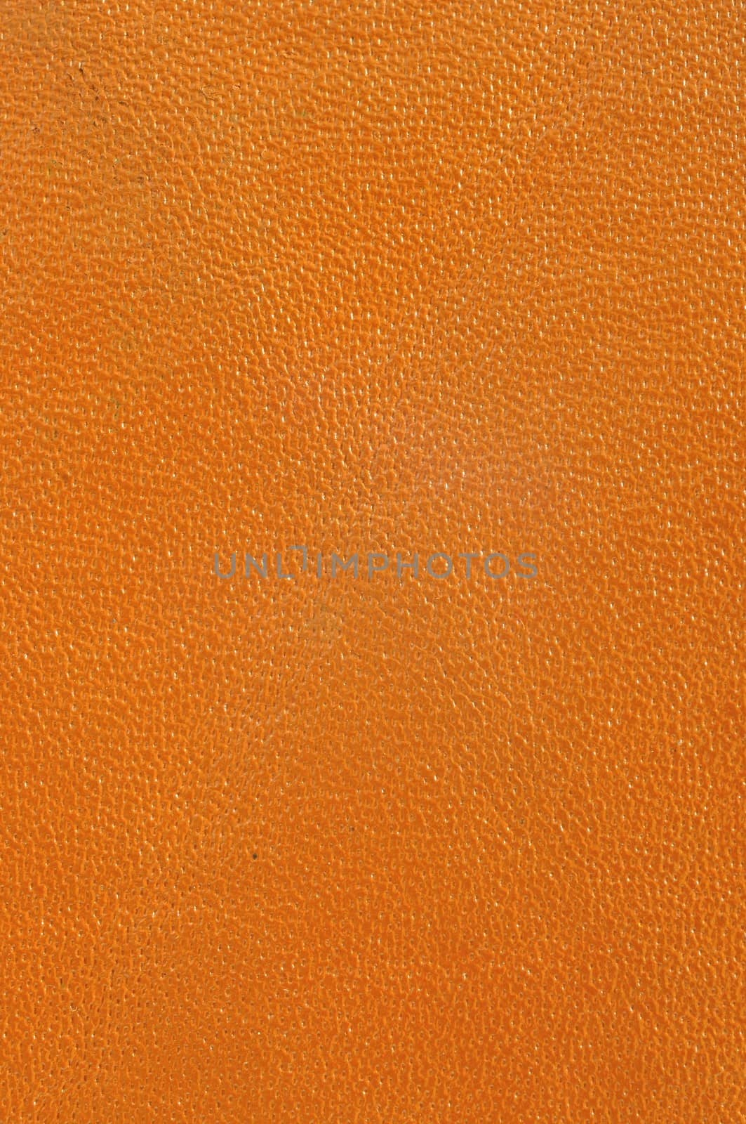 Close up texture of brown or orange leather for use as Background