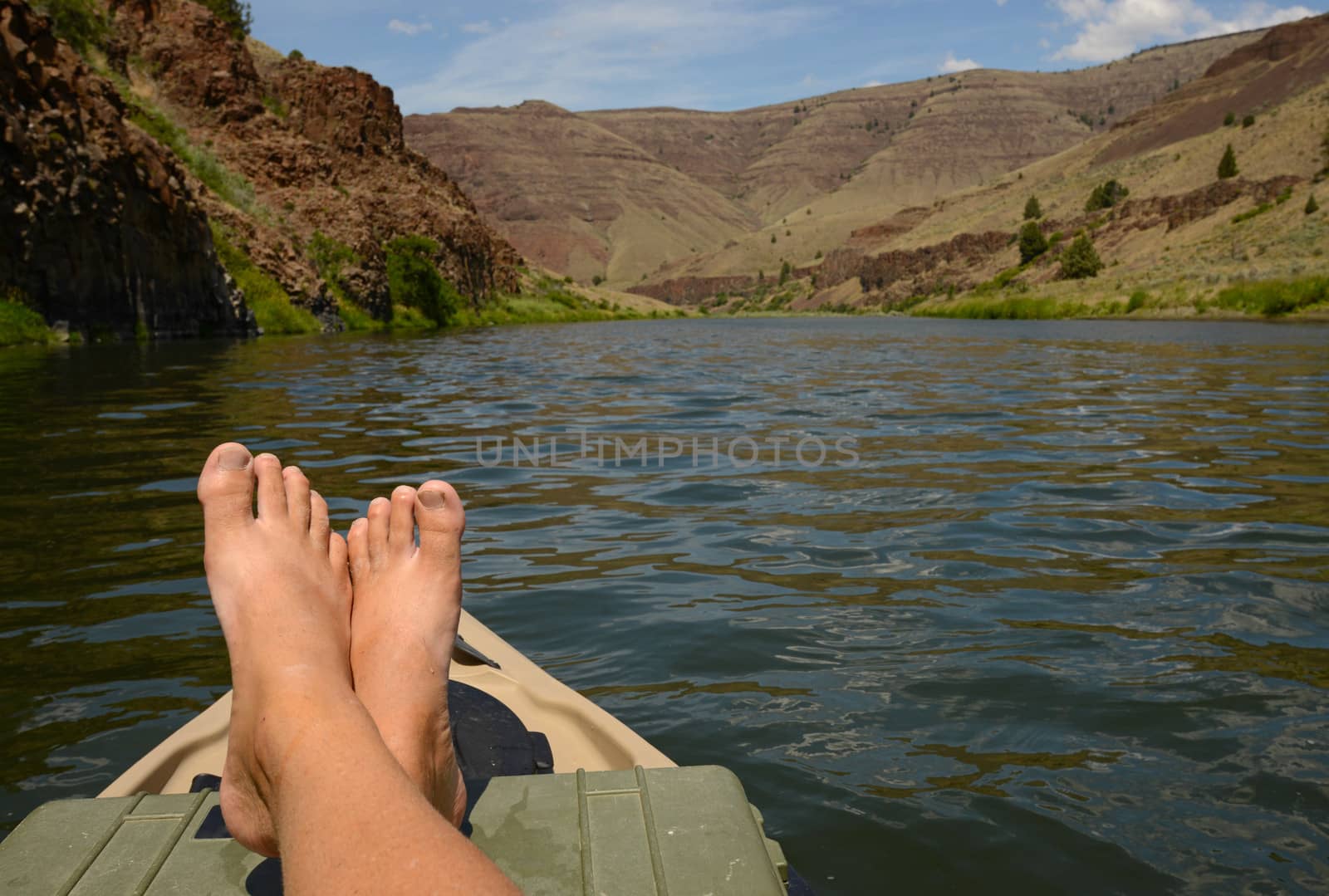 relaxing on a kayak in a beautiful landscape in oregon with mountains