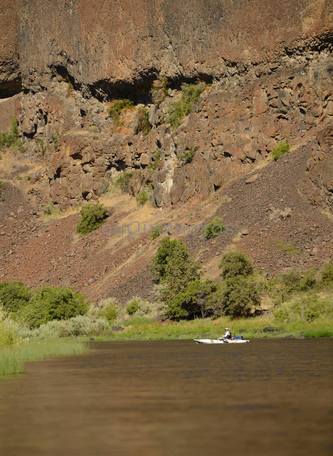 large mountain with small kayak in beautiful landscape with river in Oregon