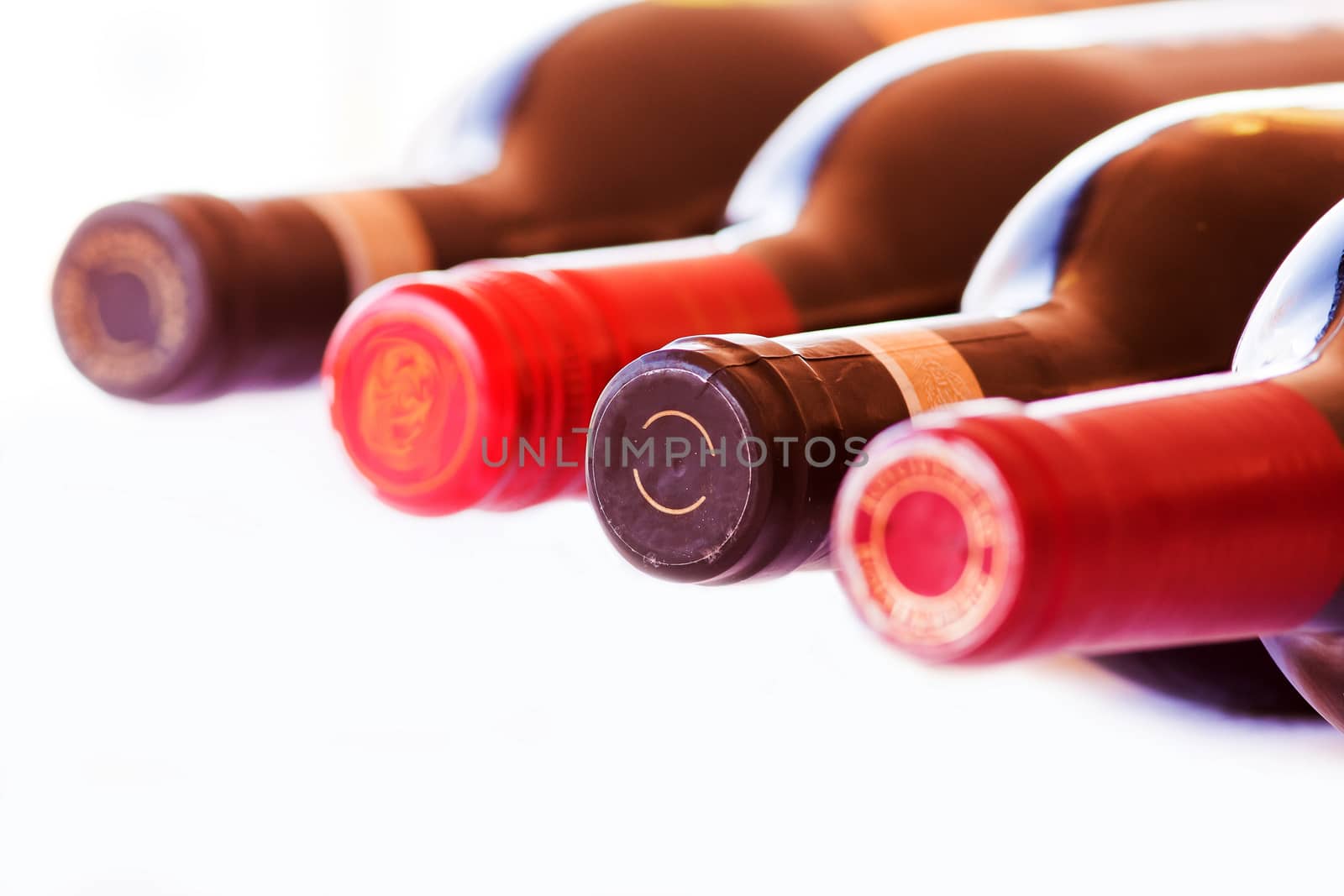 Four Bottles of red wine isolated on a white background