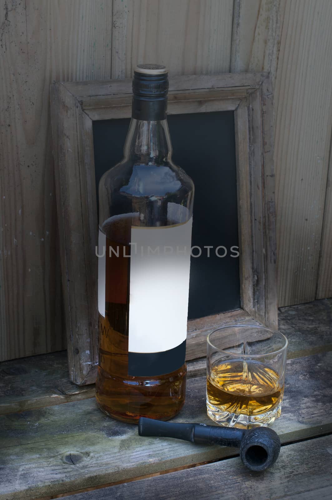 still life with whisky and a pipe