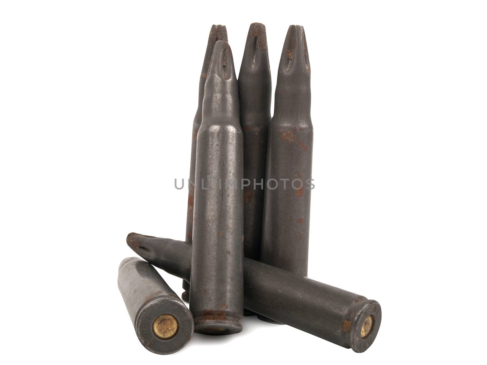 several old rusty bullets over white background