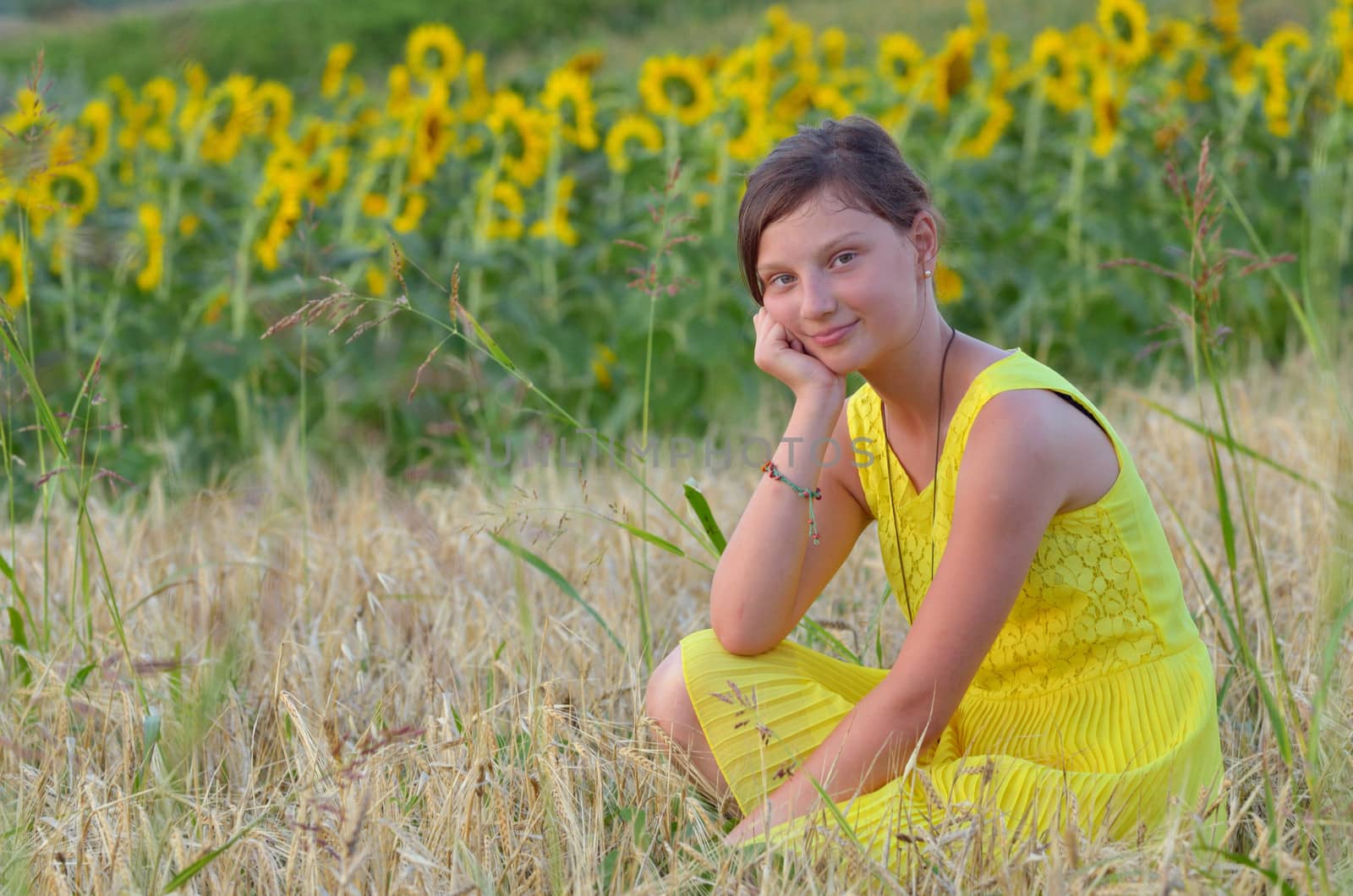  beautiful girl on fiel with background of sunflower