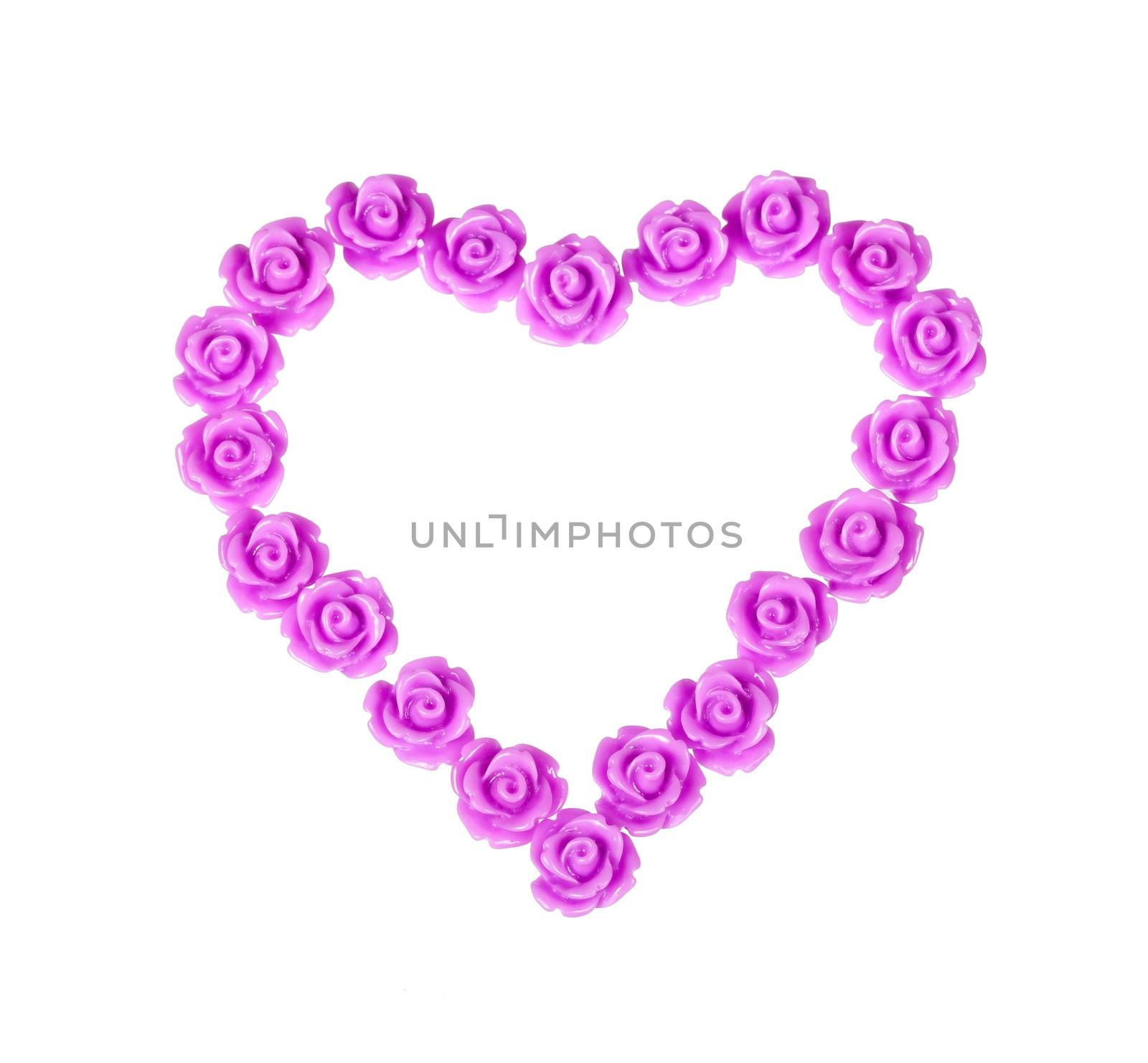 Plastic roses lilac color in the form of heart. Isolated on white background
