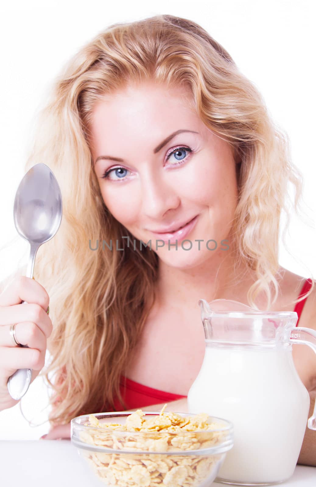 Smiling woman with spoon, milk and corn-falkes by Angel_a
