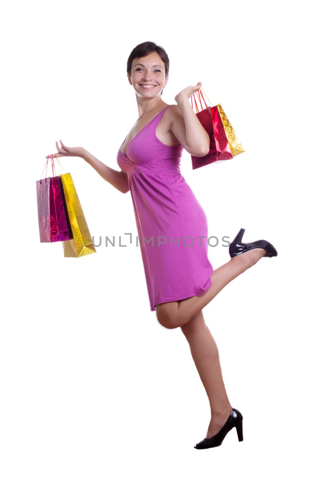 Cheerful woman with shopping bags isolated on white