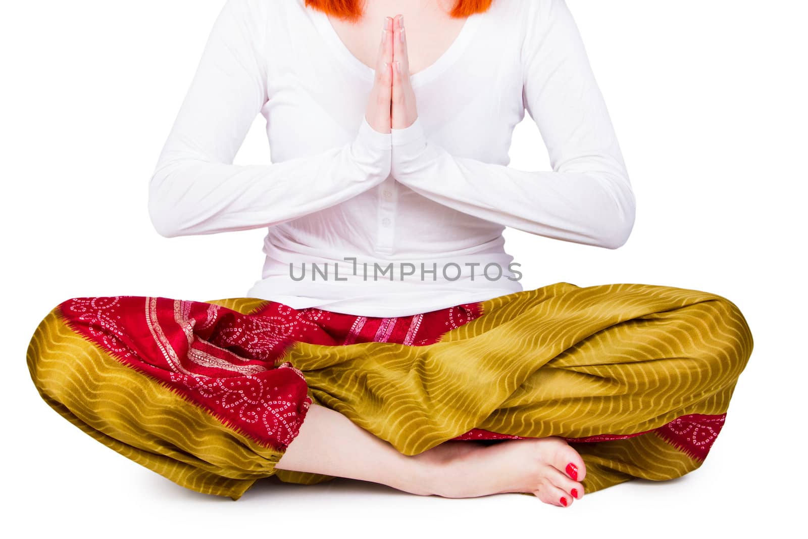 Beautiful young woman is engaged in yoga on a white background