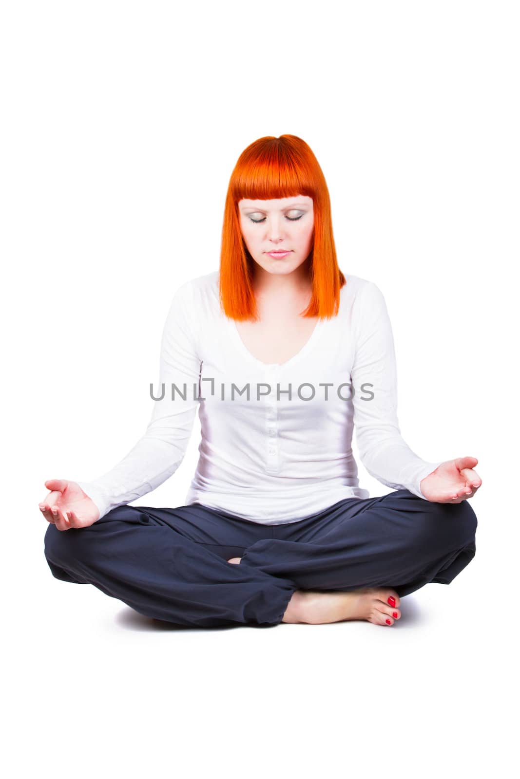 Beautiful young woman is engaged in yoga on a white background