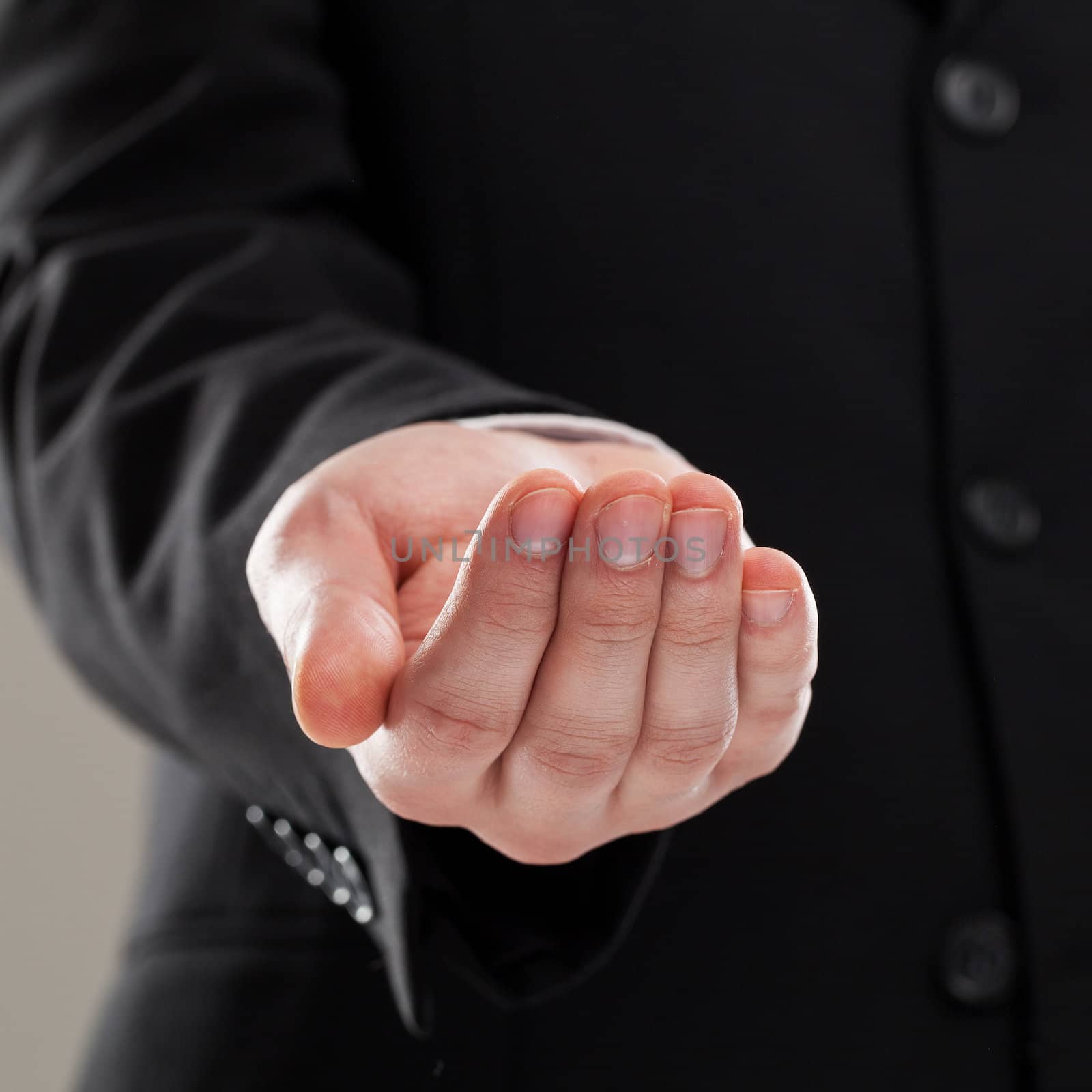 Businessman's torso in suit over grey background