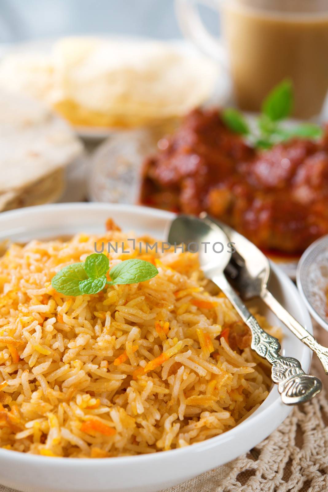 Indian cuisine biryani rice and chicken curry.