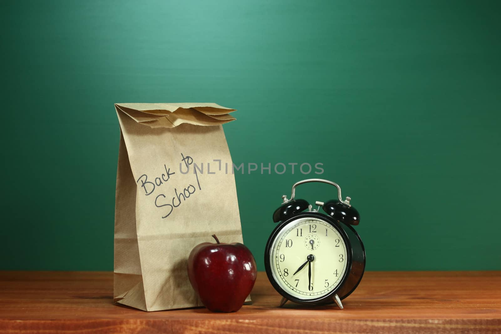 School Lunch, Apple and Clock on Desk at School by tobkatrina