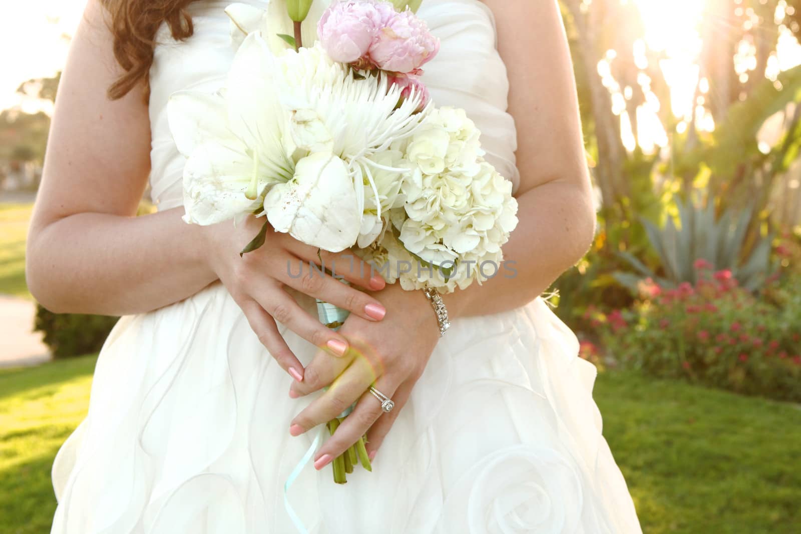 Pretty Bride on Her Wedding Day Outdoors by tobkatrina