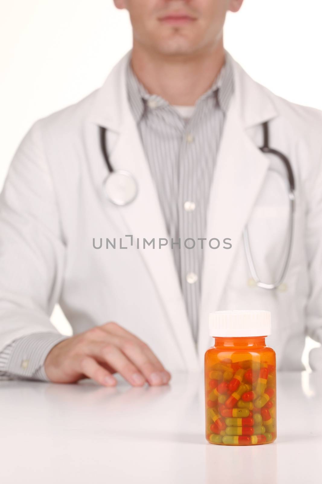 Doctor With Medication in Prescription Bottles by tobkatrina